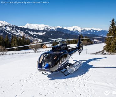 Black helicopter parked on the snow Black helicopter parked on the snow