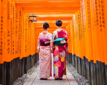 Geisha walking through Fushimi Inari Shrine Geisha walking through Fushimi Inari Shrine